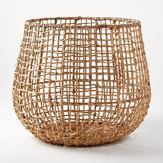 a wicker basket sitting on top of a white table