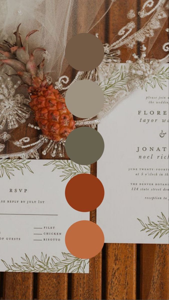 the wedding stationery is laid out on top of each other, with different colors