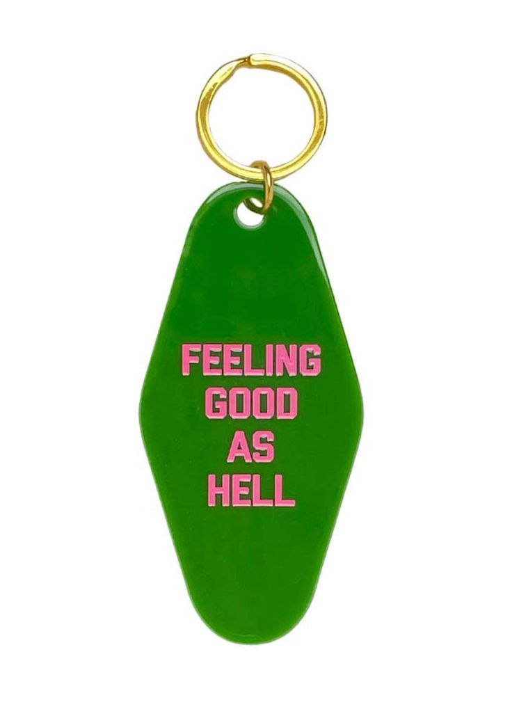 a green keychain with the words feeling good as hell on it's side