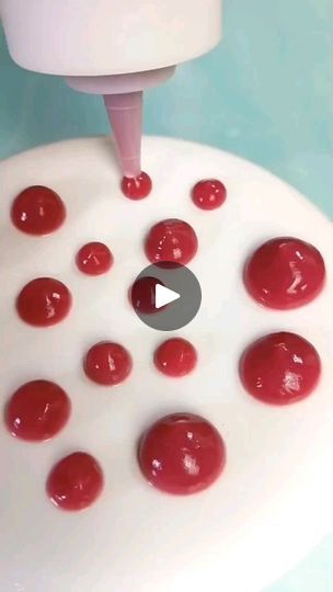 a video demonstrating how to use an electric device with red balls on the surface and in front of it