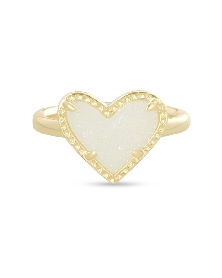 What's not to love about the Ari Heart Gold Band Ring in Iridescent Drusy, defined by an asymmetrical design of one of the world's most iconic symbols? Cute Pink Heart Ring Gift, Pink 14k Gold Heart Ring Gift, Kendra Scott White Heart Necklace, Kendra Scott Rings￼, Preppy Ring, Pink Heart Rings, Preppy Jewelry, Kendra Scott Jewelry, Jewelry Accessories Ideas