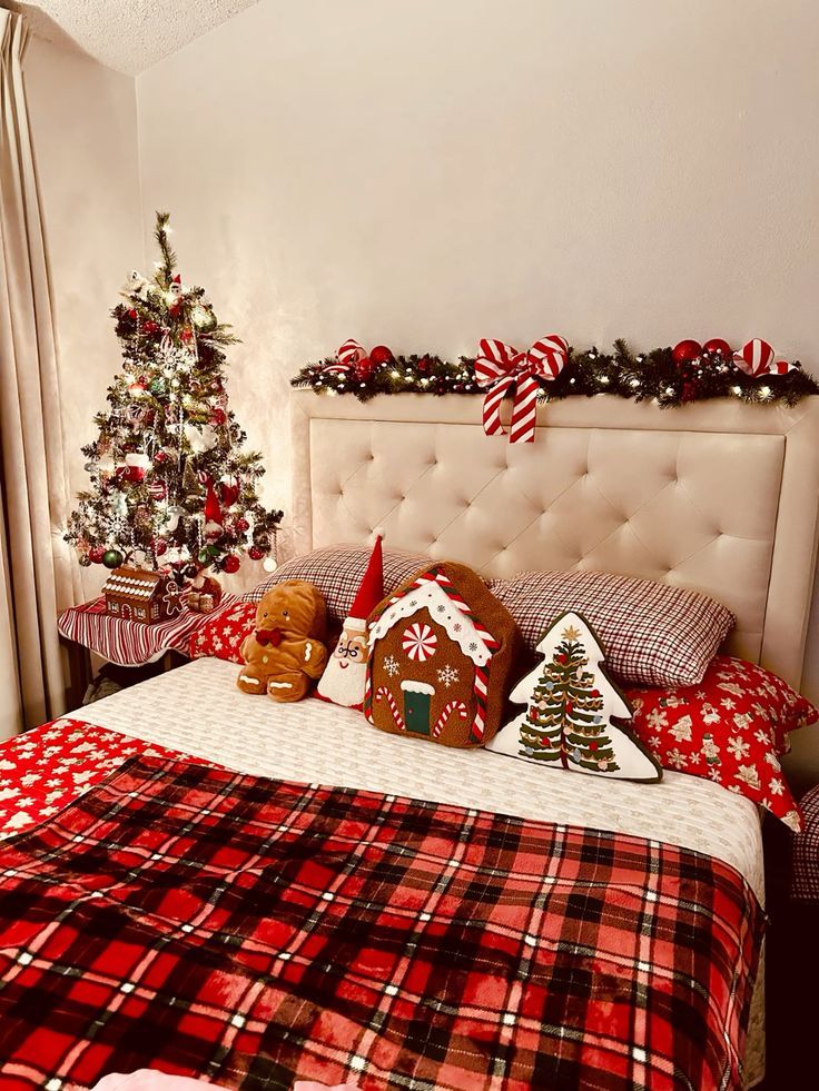 a bedroom decorated for christmas with gingerbread houses on the headboard and trees in the background