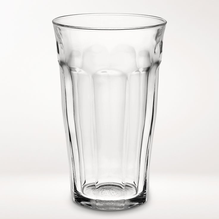 a clear glass filled with water on top of a table