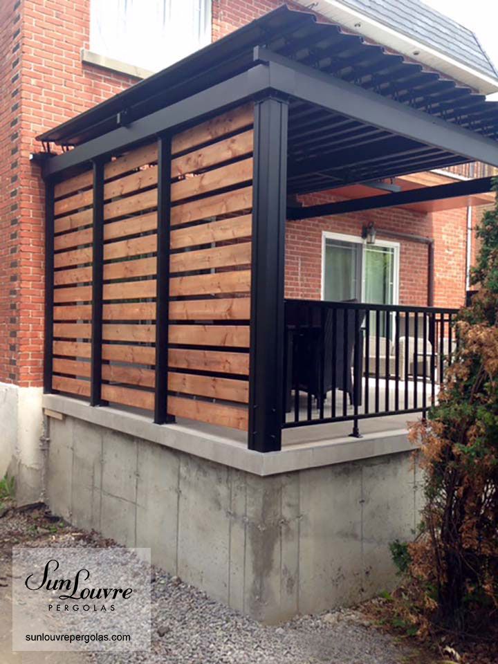 an outdoor covered patio with wooden slats