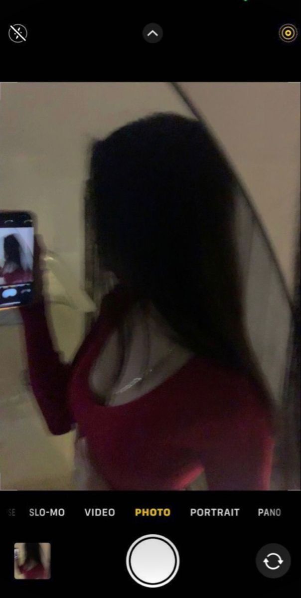 a woman is taking a selfie with her cell phone