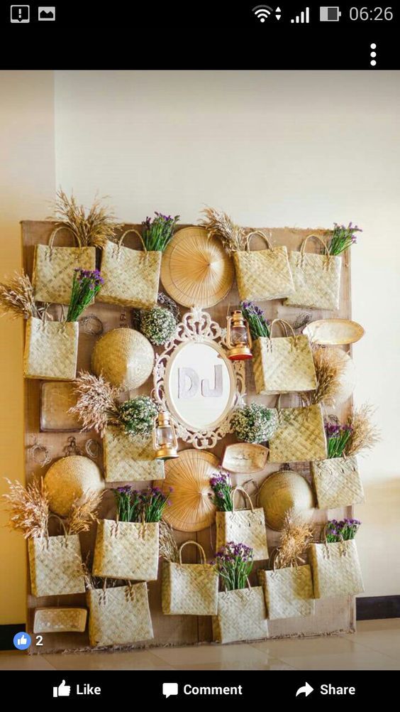 a wall with baskets and plants on it