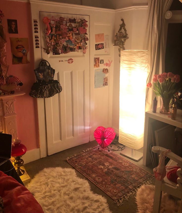 a living room with pink walls and rugs