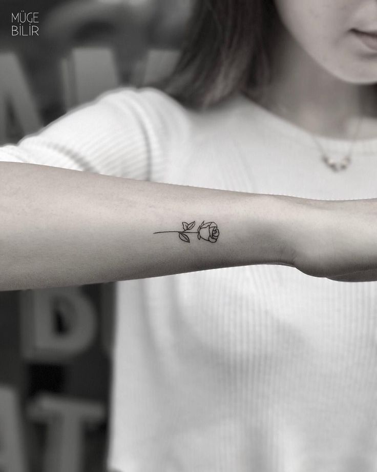 a woman with a small tattoo on her arm