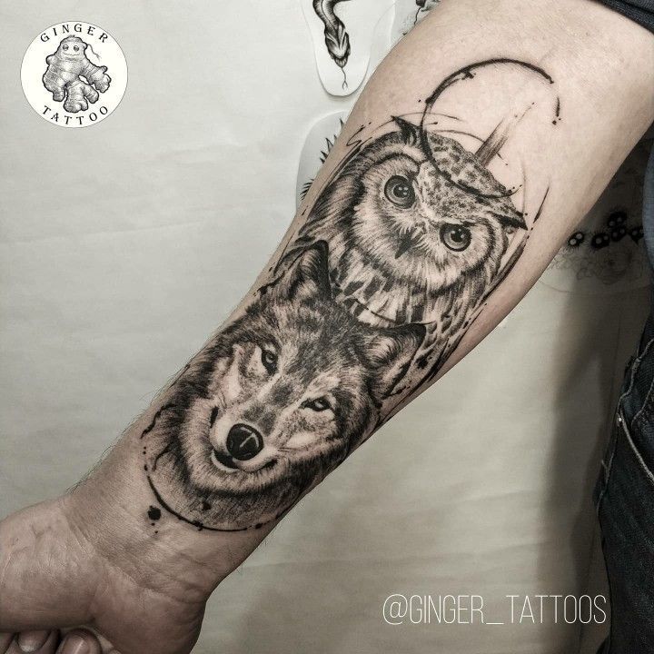 an owl and wolf tattoo on the arm