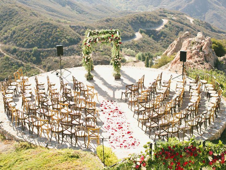 an outdoor ceremony set up in the mountains