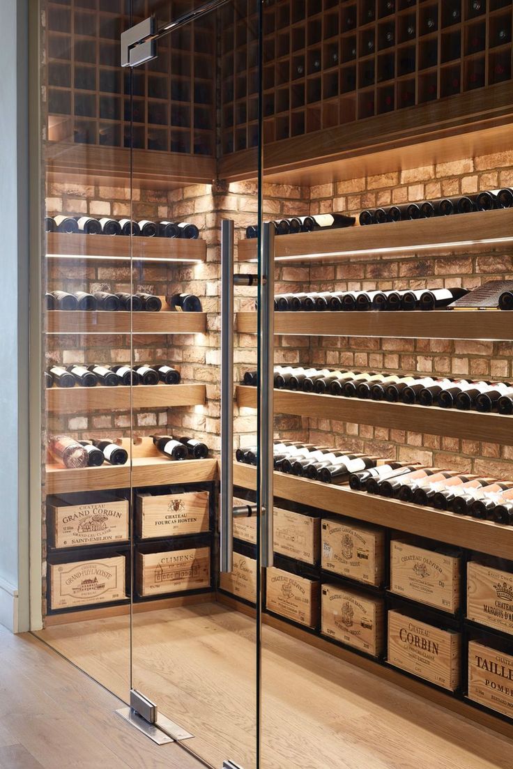 the wine cellar is filled with many bottles