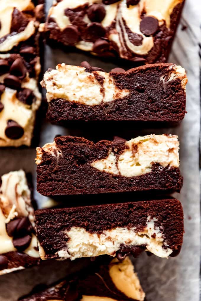 chocolate cream cheese swirl brownies stacked on top of each other