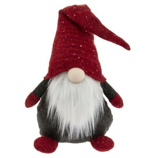 a red and white gnome stuffed animal on a white background