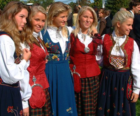 a group of young women standing next to each other