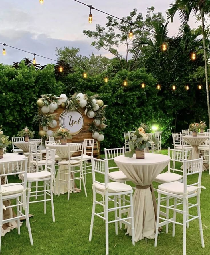 tables and chairs are set up in the grass