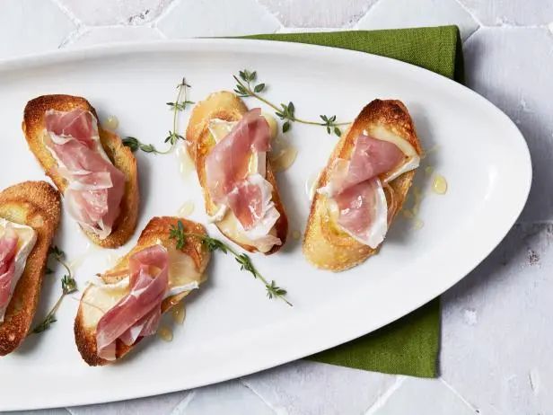 several pieces of bread with ham on them