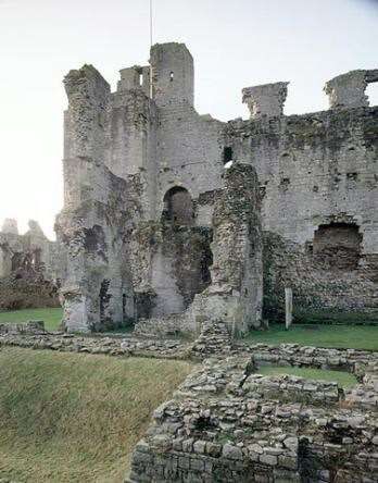 an old castle with stone walls and windows