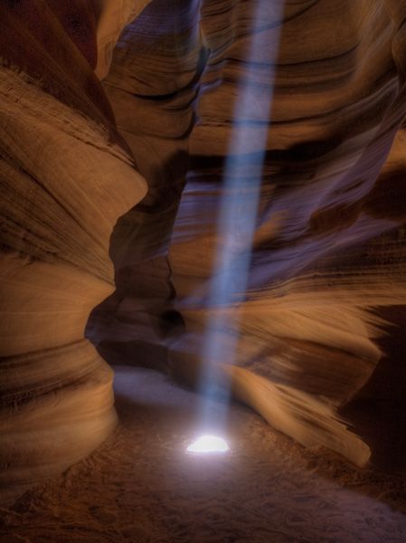 the light shines brightly through the canyon's walls