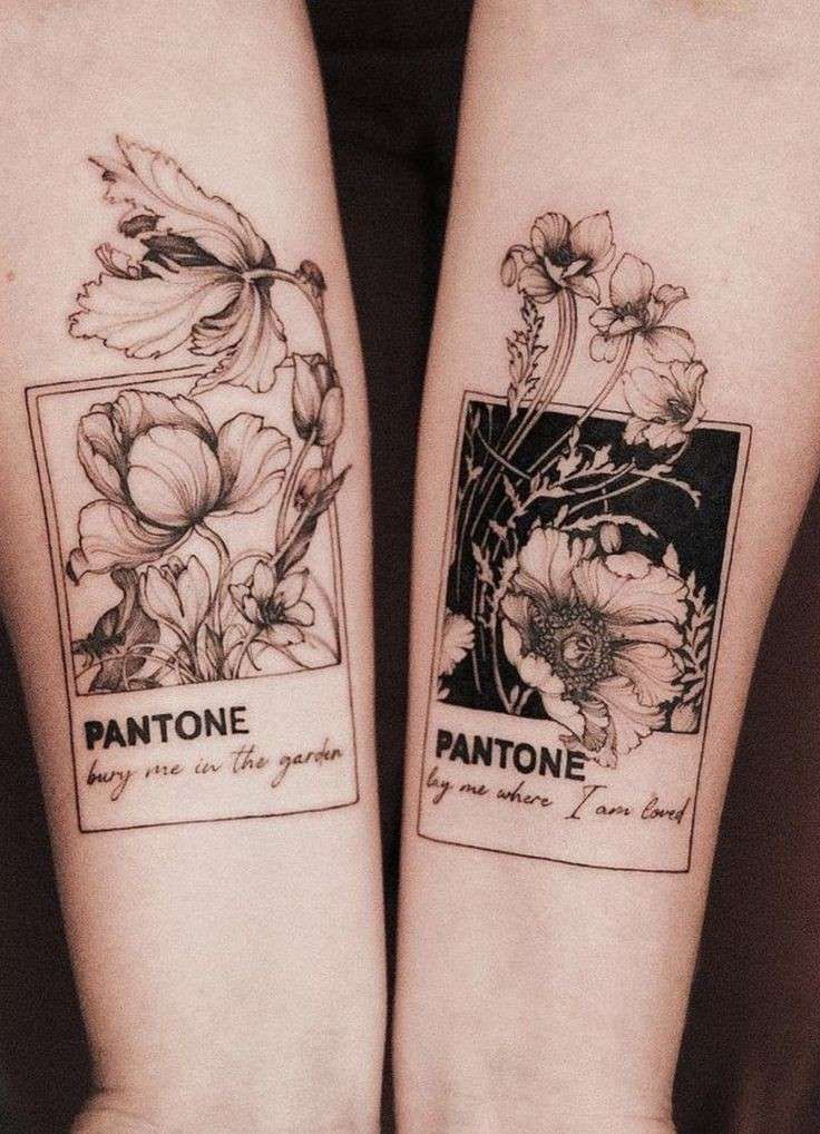 two matching tattoos on both arms with flowers and pantone written in black ink over them