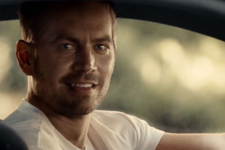 a man sitting in the driver's seat of a car