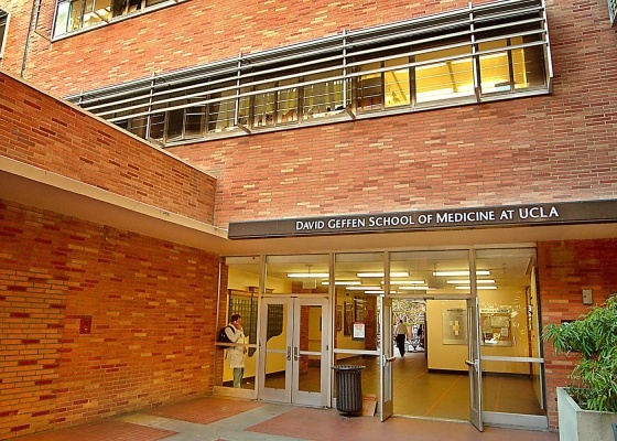 an entrance to a medical building with people entering