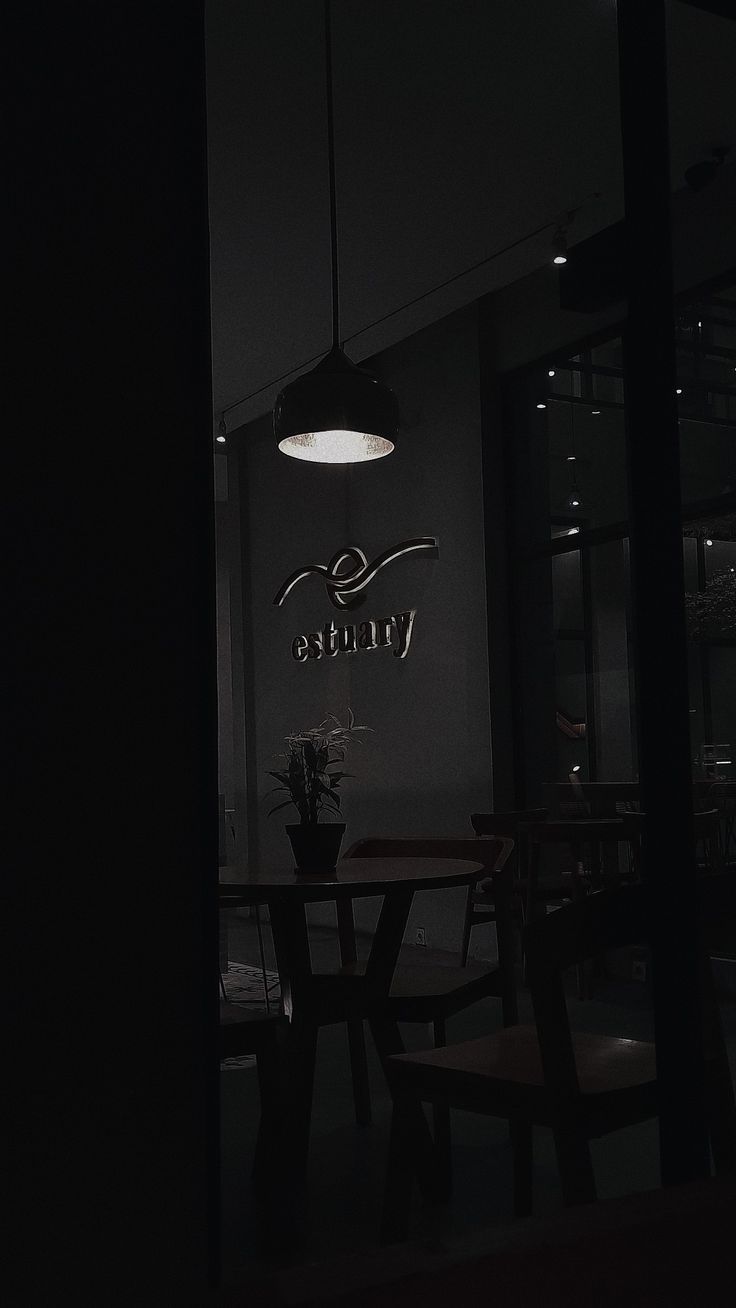 a table and chairs in a dark room with the name virtura on it