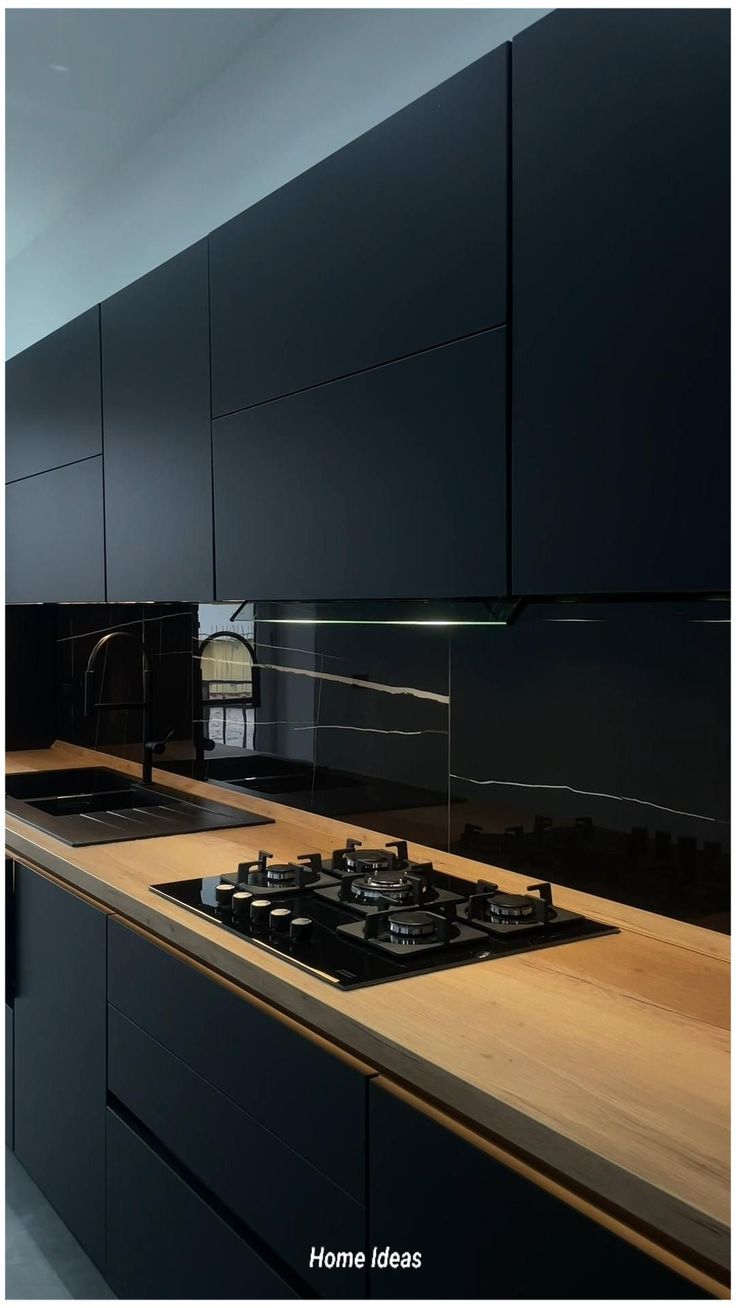 a stove top oven sitting on top of a counter next to a wooden countertop