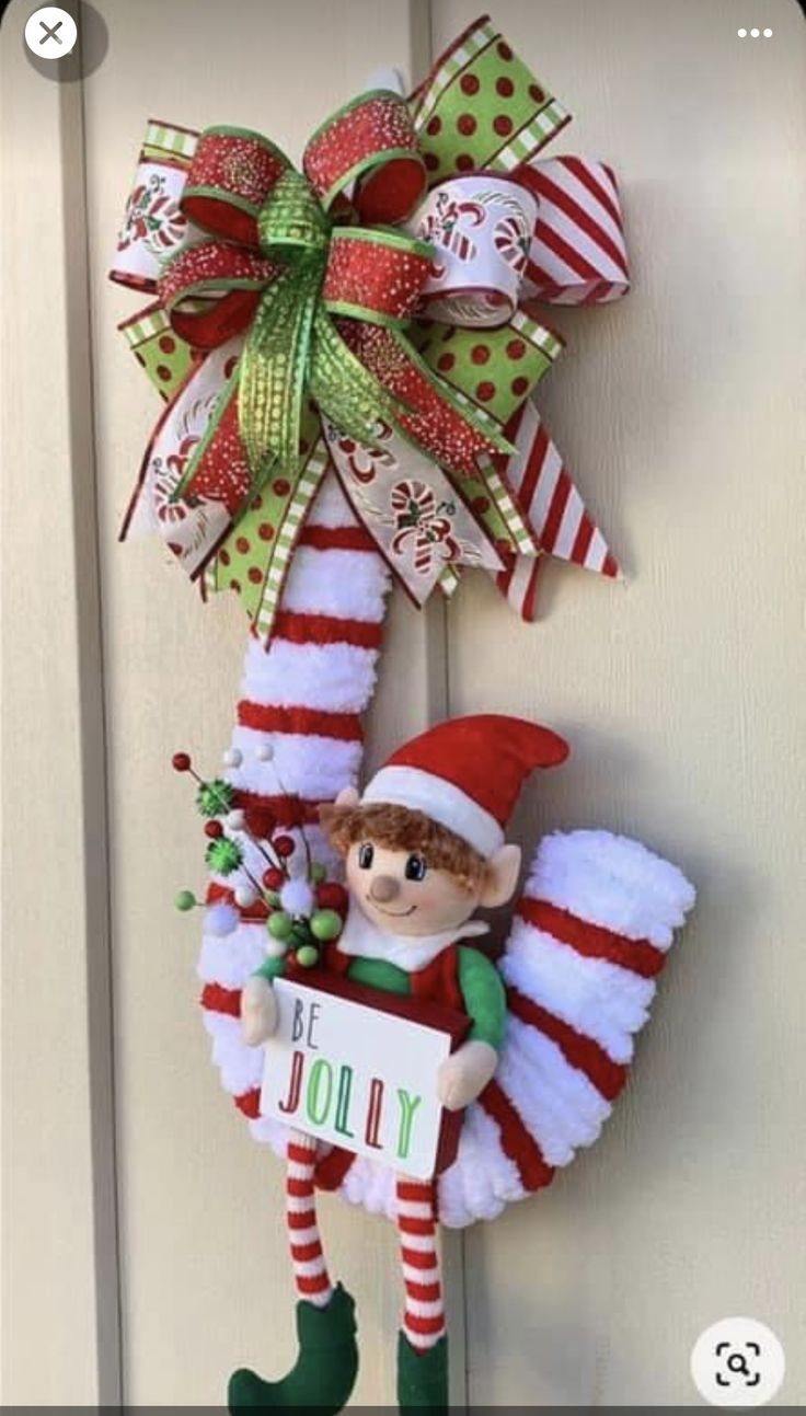 an elf is hanging on the front door