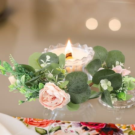 a candle and some flowers on a table