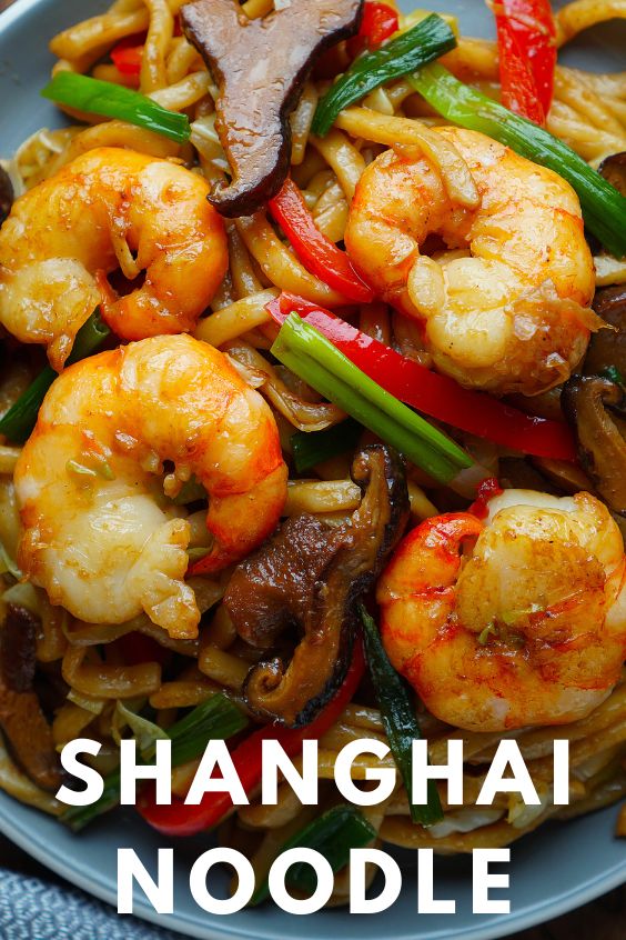 a plate with noodles, shrimp and mushrooms on it that says shanghai noodle stir fry