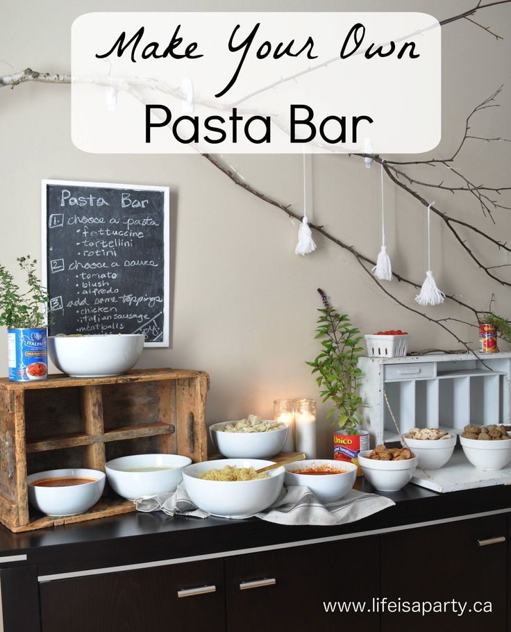 a buffet table filled with lots of food next to a chalkboard sign that says make your own pasta bar