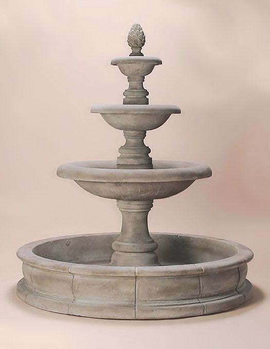 a three tiered fountain is shown against a pink background