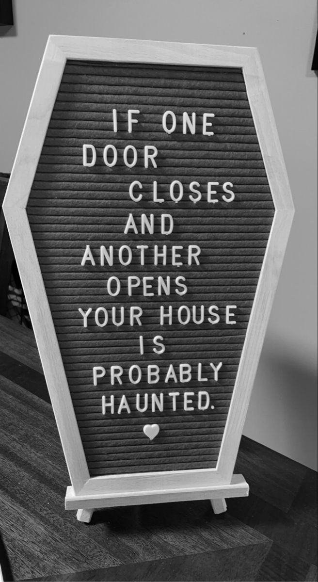 a sign that says if one door closes and another opens your house is probably haunted