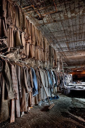 an old warehouse filled with lots of clothes