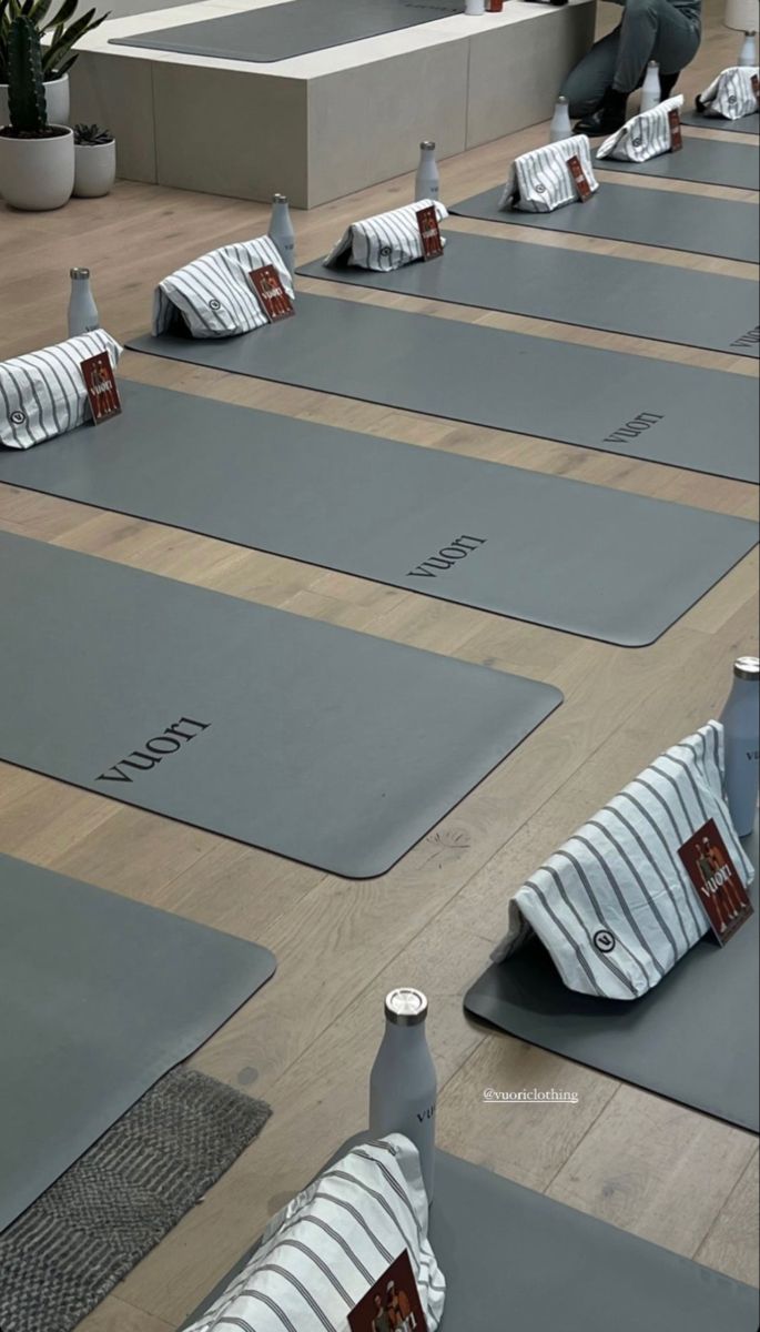 there are many yoga mats lined up on the floor