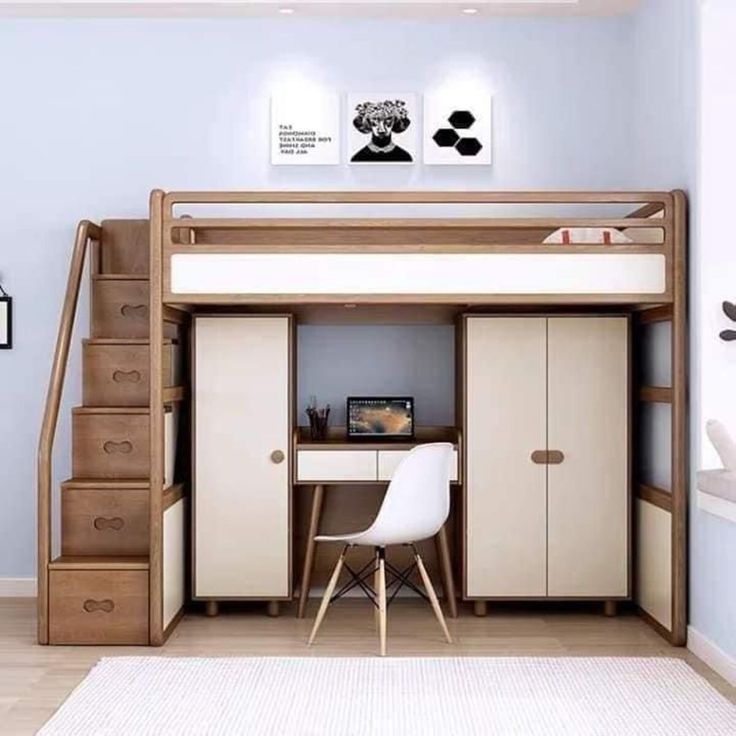 there is a loft bed with stairs to the top and desk below it in this room