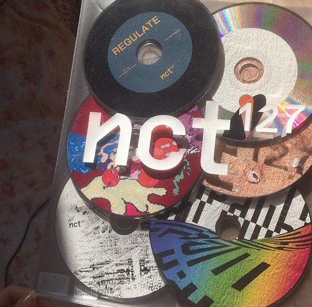 cd's with the word nct displayed on them