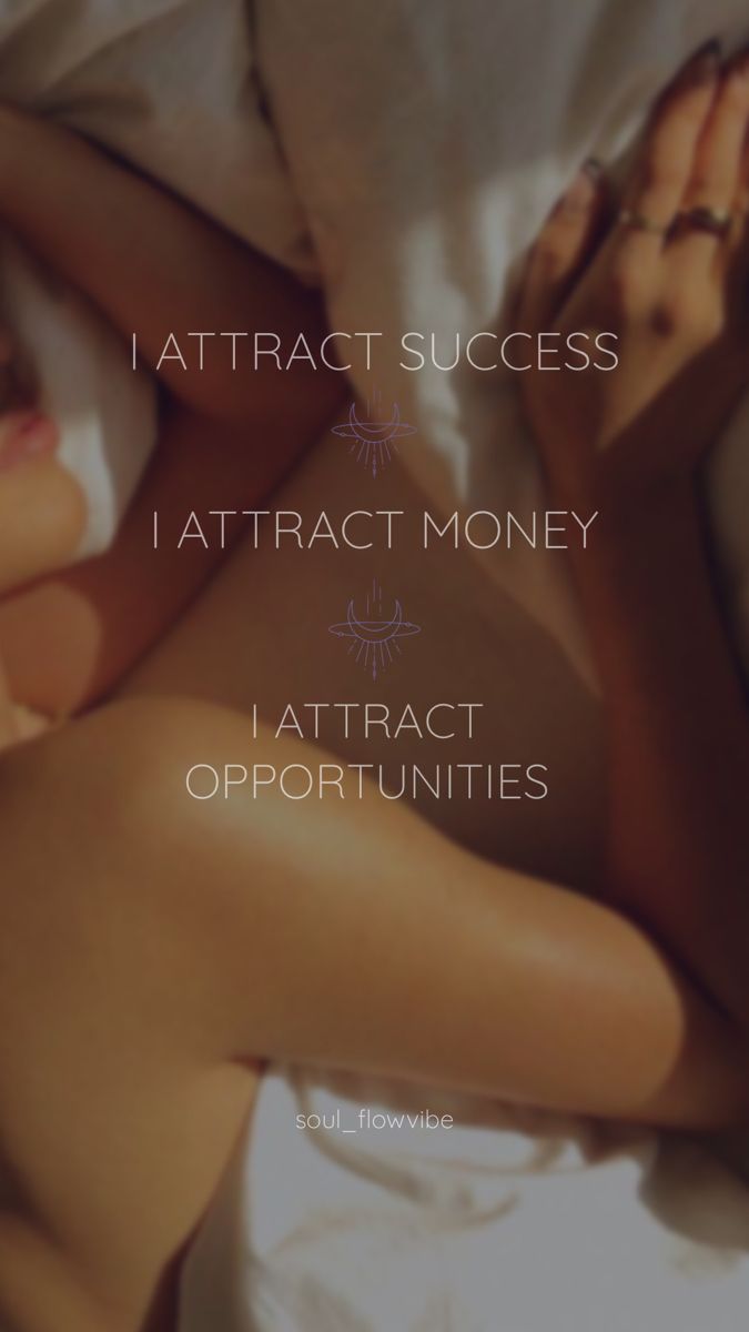 a woman laying on top of a bed under a white comforter with the words attract success i attract money