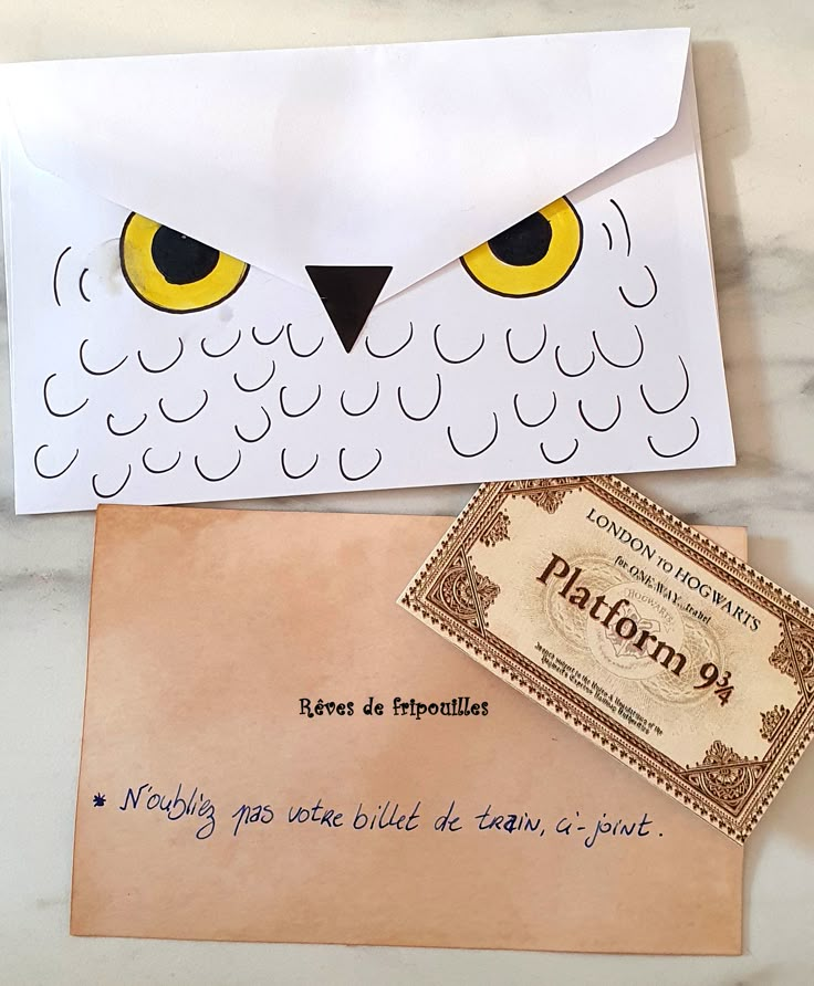 an envelope with a paper owl on it and a note attached to the envelope that says pafon 9