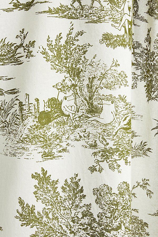 a green and white toiler print curtain with animals in the woods on it