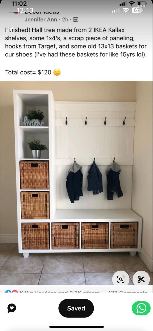 a white bench with baskets and clothes hanging on it