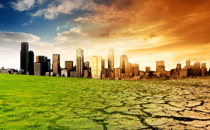 an image of a city that is in the middle of a green field with cracked grass