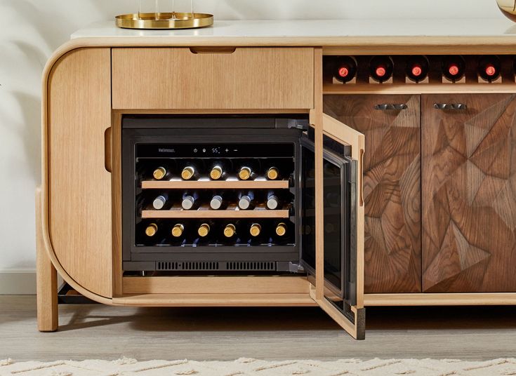 an open wine cooler with many bottles in it