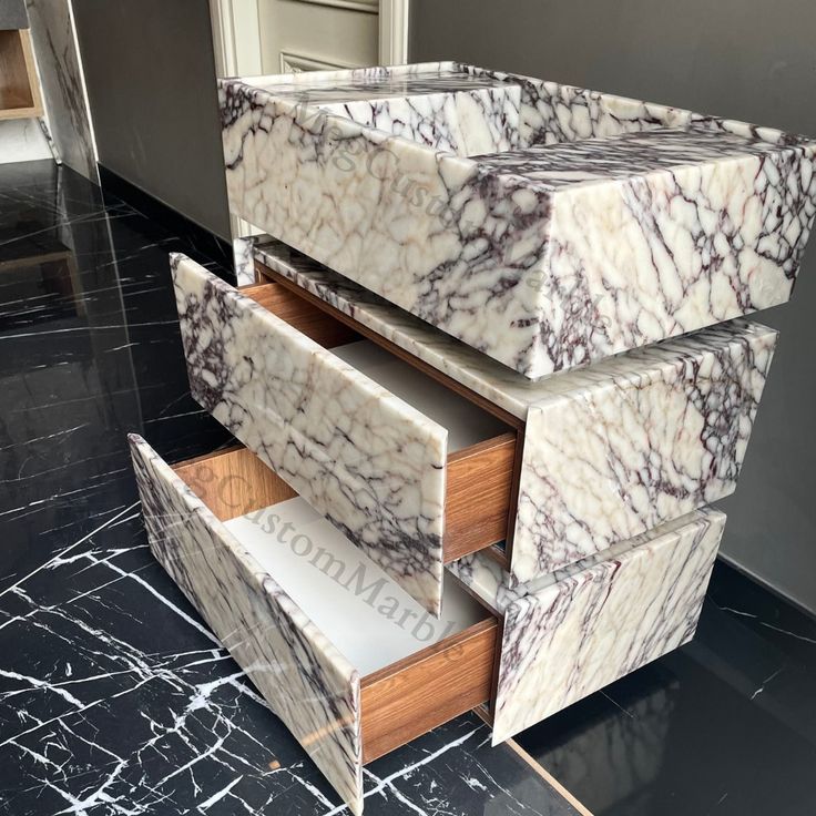 marble drawers are stacked on top of each other