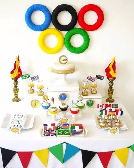 a table topped with lots of desserts and decorations