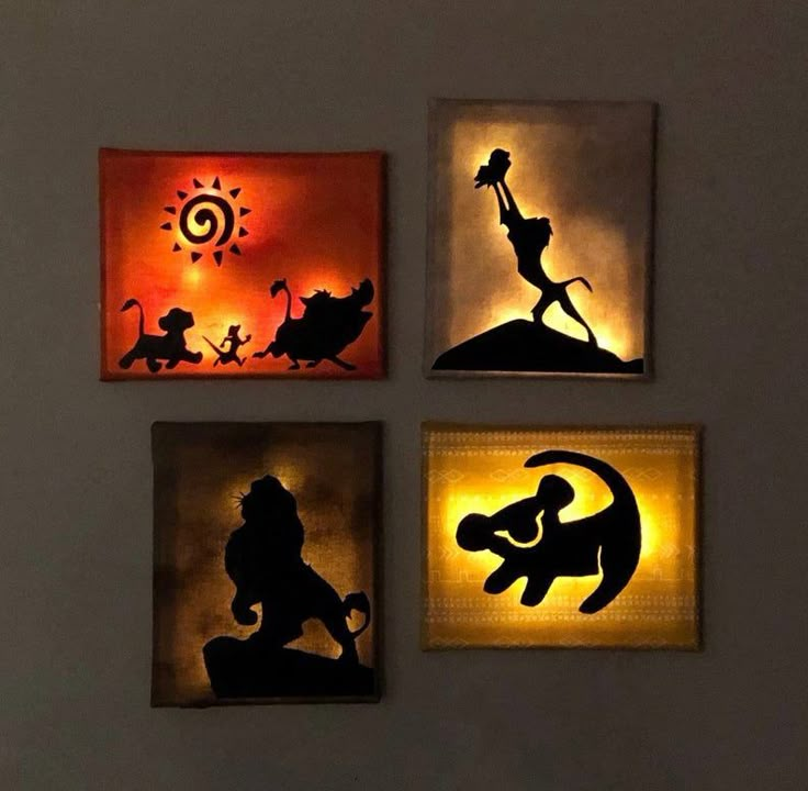 the silhouettes of disney's characters are displayed on canvases with lights in them