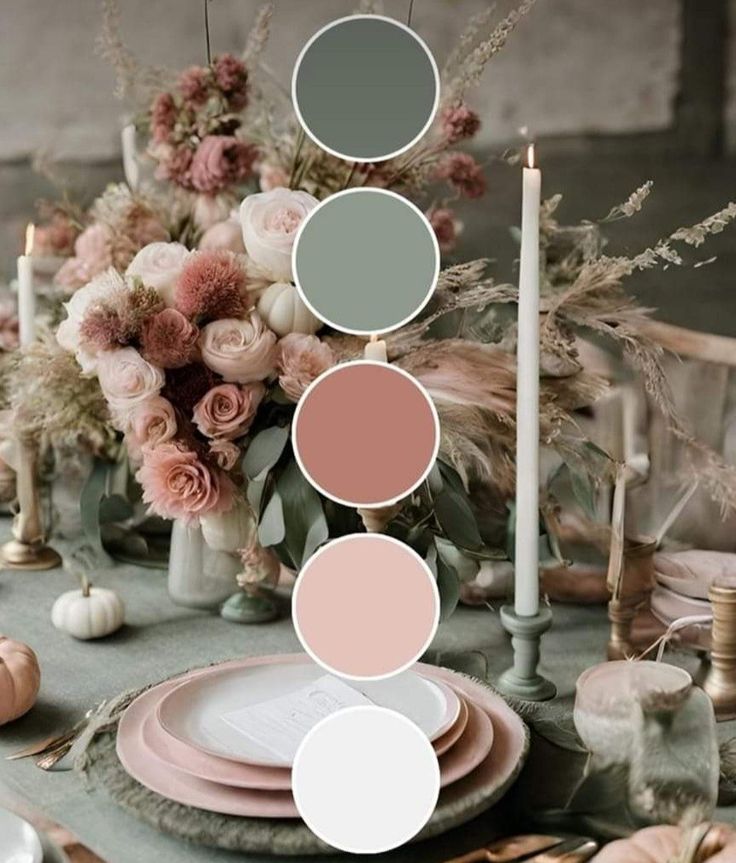 a table topped with plates and flowers next to candles