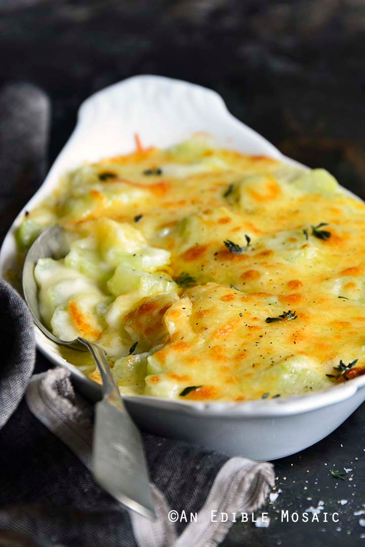 a casserole dish with broccoli and cheese in it is ready to be eaten