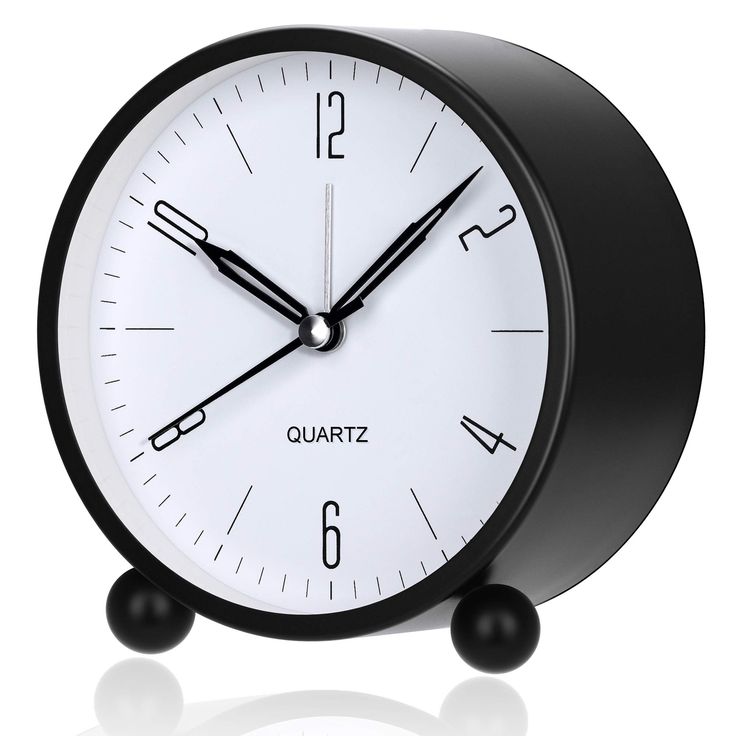 a black and white clock with the word quartz on it