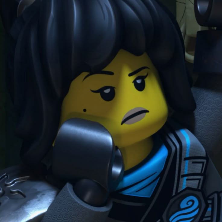 a lego character holding a phone to his ear